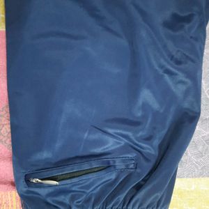 Navy Blue Lower or Traking pants with chain detailing pockets at front and back. elasticated and also have drawstrings on the waist