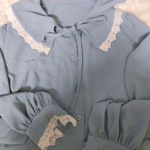 Work wear , nice faded blue lose blouse with lace collar, and sleeves white lace.