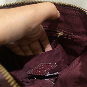 Fossil burgundy sling bag