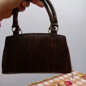 Brown Handheld bag