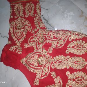 red blouse with golden stone work.