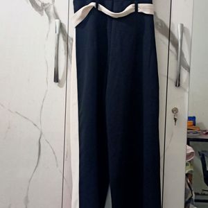 Black Jumpsuit With Cut On The Side Of Pants