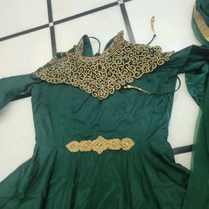 Luxurious Silk Dark Green Gown With Golden Stone