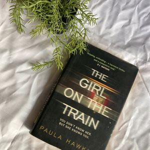 HARDCOVER GIRL ON THE TRAIN