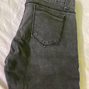 Faded Black Jeans With Knee Ripped