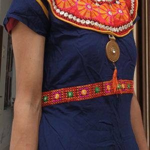 Flared Women Kurti With Rajasthani Work .