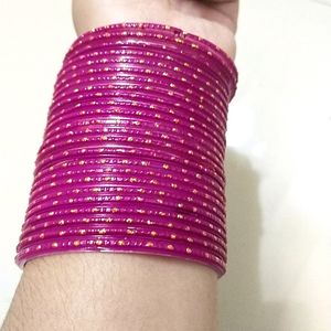 A Beautiful Rani Pink Colour Bangles With Golden