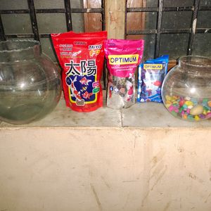 Two Fish Bowl And Three Packets Of Fish Food And Stones Also