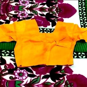 IT IS A MUSTARD COLOR WOMEN'S BLOUSE....