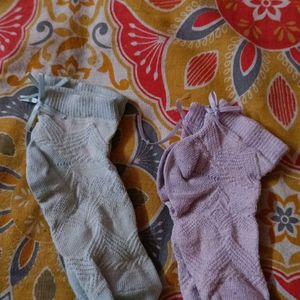 Two Pairs Of Baby Socks. Pink And Green