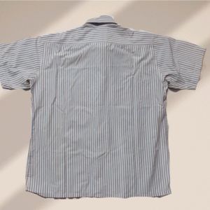 light blue and white formal shirt with a thin stri