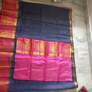 A Pattu Navy Blue nd Pink Coloured Saree.