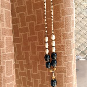 A Black nd White Pearl Necklace With Golden Work