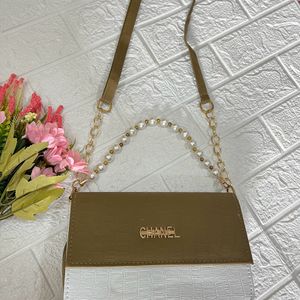 Olive green pearl handle sling bag