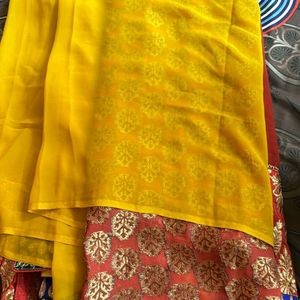 YELLOW ORANGE SHIFFON AND HEAVY EMBROIDERY SAREE