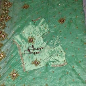 Net Saree With Blouse In Green Colour