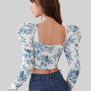 Floral Print: This long sleeve blouse features a v