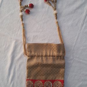 Golden Potli Bag With Red Lace