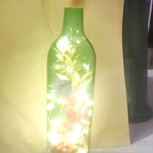 Bottle Lights With Flowers And Decorative Pieces