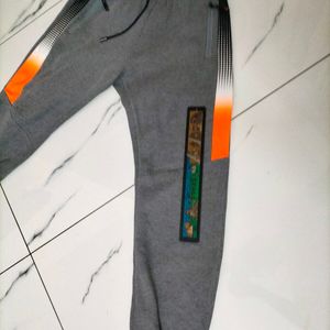 Grey ETEN joggers.