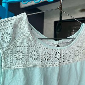 Mint green T-shirt with embroidery details