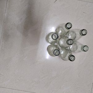 7 Empty Glass Bottles