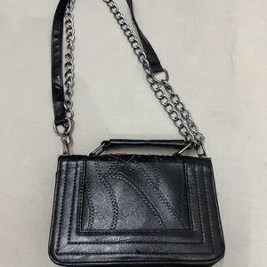 Punched Black Sling Bag.