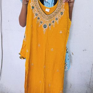 Beautiful Orange Kurti With Dark Green Grara.