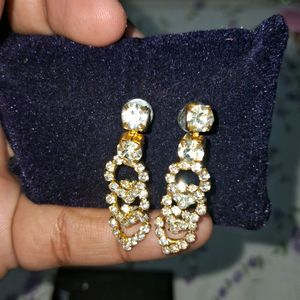 Gold shine earrings and