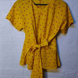 "Sunny Chic: Yellow Polka Dot Top with Tie-Up Bow"