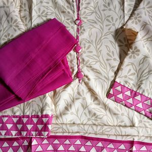 A Cream Coloured Kurta With Pink Design