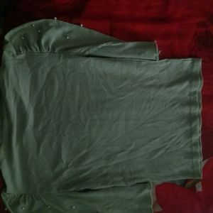 I'm Selling a Girls Top Of Light Green With Pearls