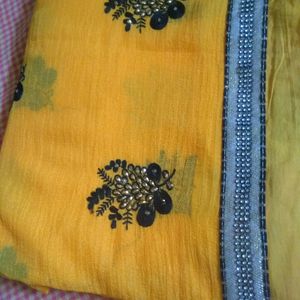 Elegant Yellow Saree With Beautiful Black And Silver Border