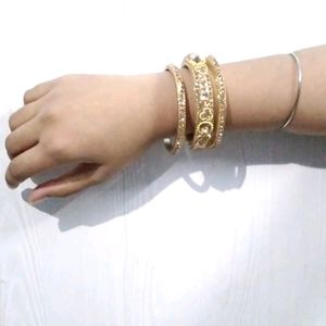 Set Of Three Bangles In Golden Color