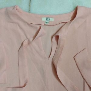 PEACH TIE UP AND PEPLUM TOP