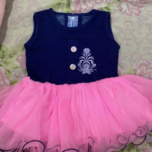 Baby girl party wear frock with pink net in bottom And blue jean upper side,suitable for 1-1.5 yrbaby girl,has button In front and has soft net,baby will be comfortable in this cloth,has zip in back