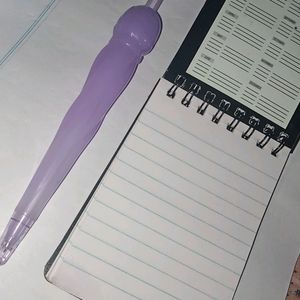 Cute Purple Pen And A Small Notepad..