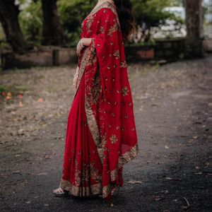 Red saree with golden zari work