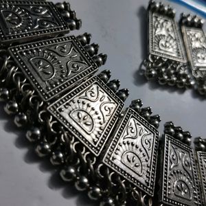 Combo Of One Black Metal Necklace With Earings And A Set Of Silver Bangles