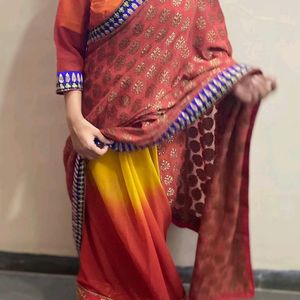 YELLOW ORANGE SHIFFON AND HEAVY EMBROIDERY SAREE