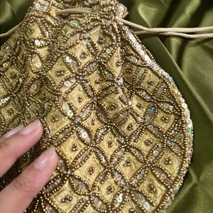 Beautiful zari embroidery Gold Potli Bag