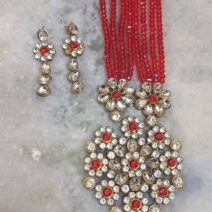 A Red Beads Jewellery with heavy locket& earrings