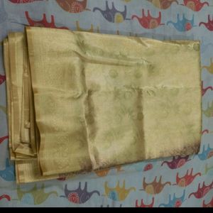 Golden Zari Knitting Work On Brown Base saree