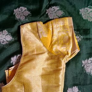 A Bottle Green Colour Saree With Yellow Border