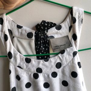 white and black polka dot mini dress