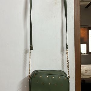 Party Wear Green Sling With Metal Chain Detail
