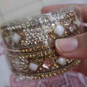 Stone Bangles Of White And Golden Color.