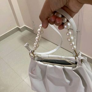 White pearl handbag