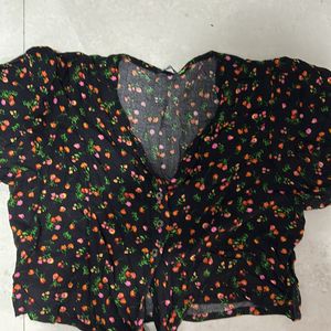 Black top with floral design