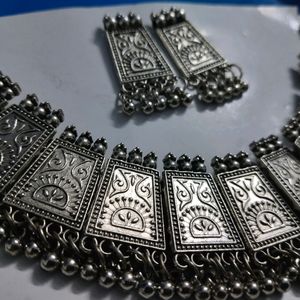 Combo Of One Black Metal Necklace With Earings And A Set Of Silver Bangles